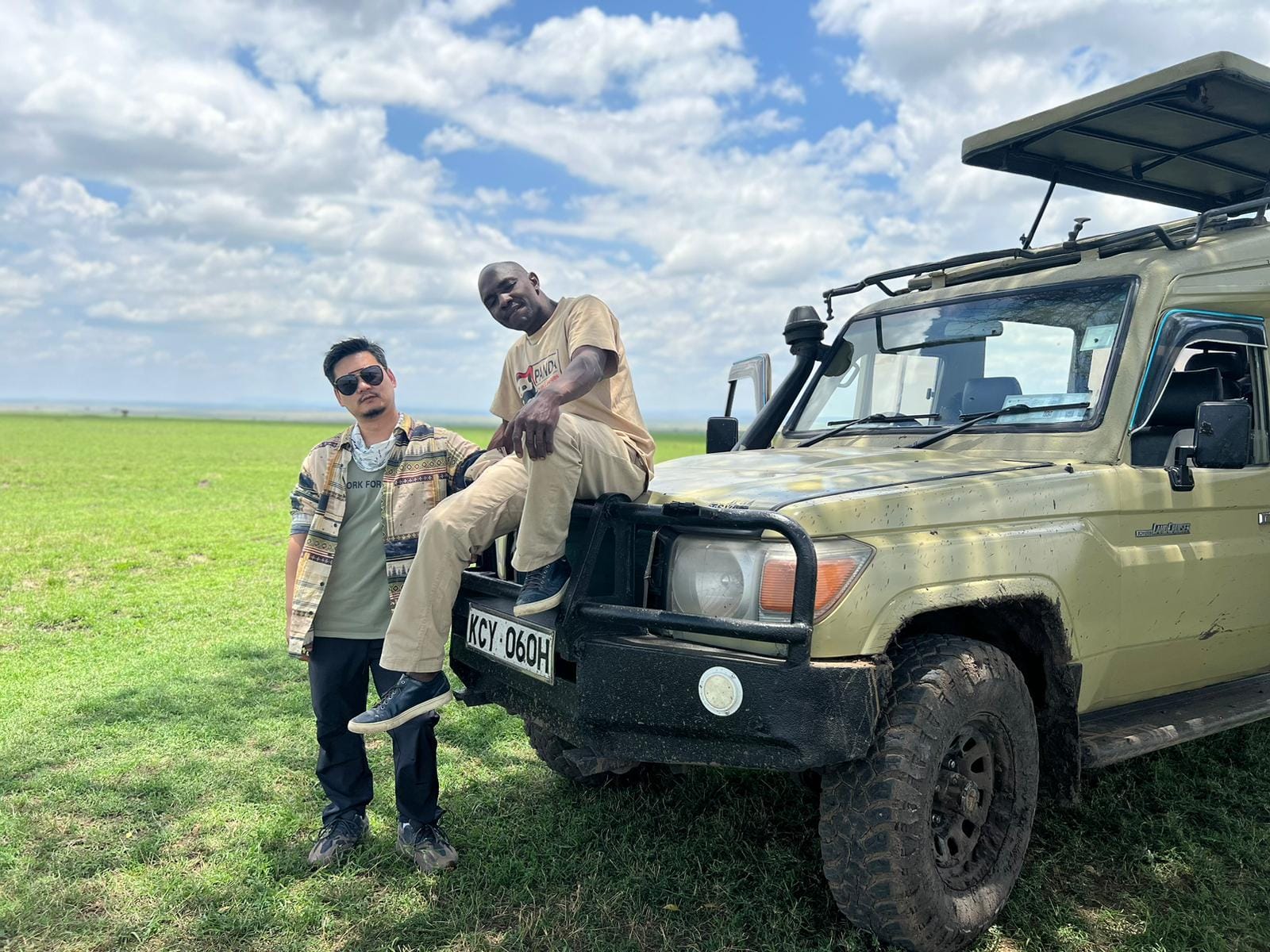 Afrika Sights and Adventures guide with safari guests in the Mara