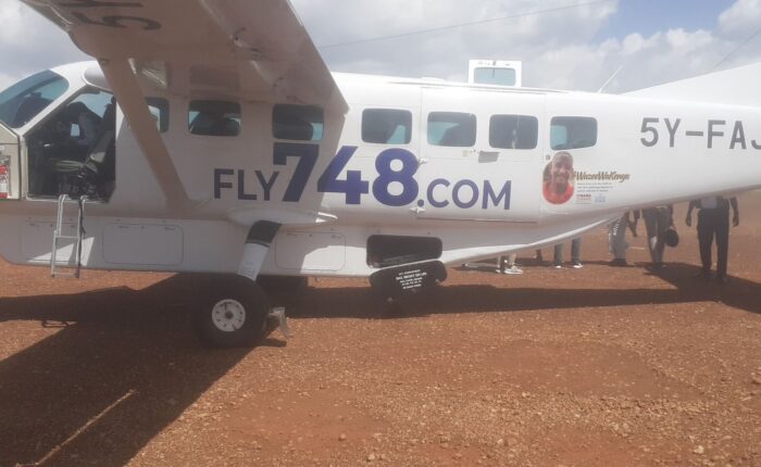 Boarding a light aircraft for the Mara